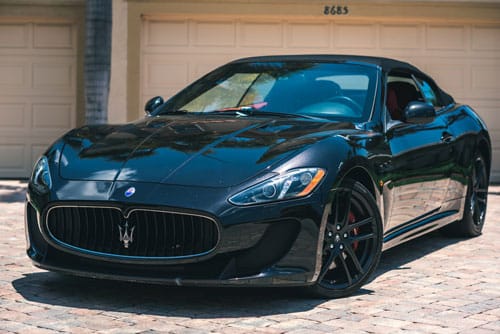 Black Maserati Parked In Driveway